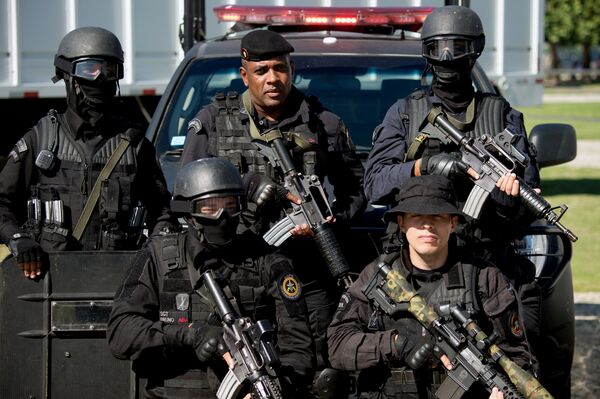 Members of the Battalion of Special Police Operations (BOPE) pose during the presentation of security forces for the upcoming FIFA World Cup, in Flamengo beach in Rio de Janeiro. (File) Members of the Battalion of Special Police Operations (BOPE) pose during the presentation of security forces for the upcoming FIFA World Cup, in Flamengo beach in Rio de Janeiro. (File) - Sputnik International