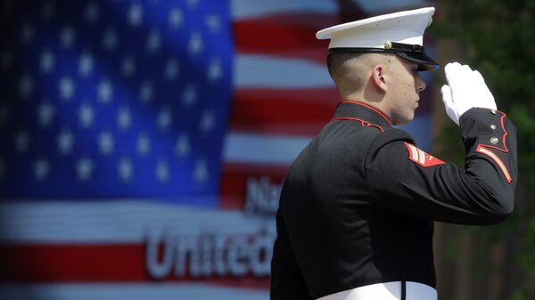 An officer of the US Marine Corps Color Guard stands at attention during the flag raising ceremony at the official opening of the National Day USA, at the Expo 2015 world's fair in Rho, near Milan, Italy, Saturday, July 4, 2015. - Sputnik International