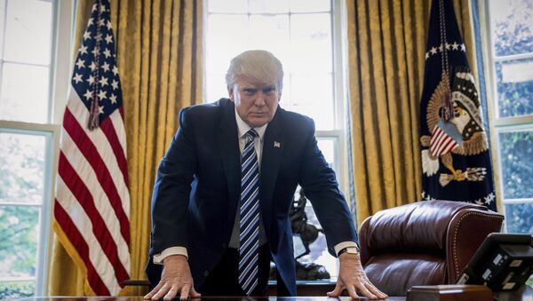 In this April 21, 2017, file photo, President Donald Trump poses for a portrait in the Oval Office in Washington after an interview with The Associated Press. - Sputnik International