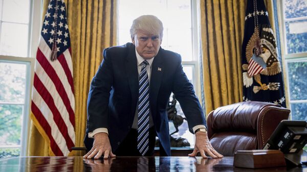 In this April 21, 2017, file photo, President Donald Trump poses for a portrait in the Oval Office in Washington after an interview with The Associated Press. - Sputnik International