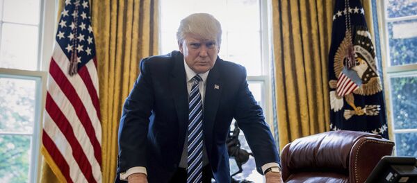 In this April 21, 2017, file photo, President Donald Trump poses for a portrait in the Oval Office in Washington after an interview with The Associated Press. In this April 21, 2017, file photo, President Donald Trump poses for a portrait in the Oval Office in Washington after an interview with The Associated Press. - Sputnik International