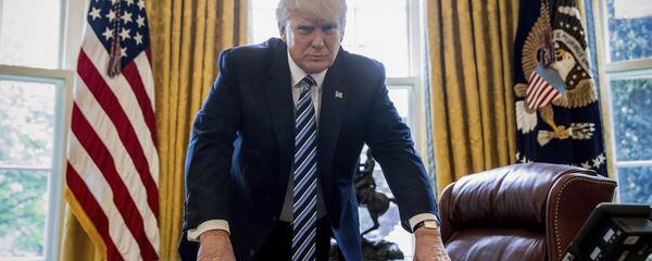 In this April 21, 2017, file photo, President Donald Trump poses for a portrait in the Oval Office in Washington after an interview with The Associated Press. - Sputnik International