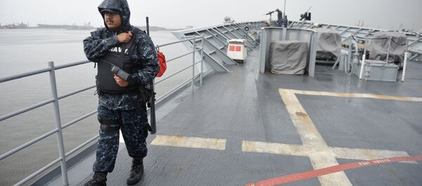 An US Navy officer walks on deck at the USS cruiser Vella Gulf missile cruiser. (File) An US Navy officer walks on deck at the USS cruiser Vella Gulf missile cruiser. (File) - Sputnik International