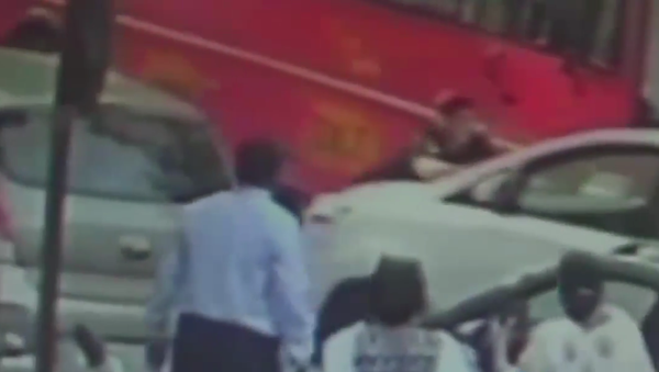 A Mumbai police officer runs down a pedestrian with his car over a financial dispute. - Sputnik International