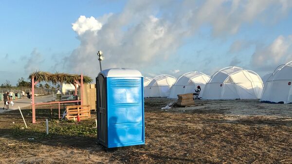 This photo provided by Jake Strang shows tents and a portable toilet set up for attendees for the Fyre Festival, Friday, April 28, 2017 in the Exuma islands, Bahamas. Organizers of the much-hyped music festival in the Bahamas canceled the weekend event at the last minute Friday after many people had already arrived and spent thousands of dollars on tickets and travel.  - Sputnik International