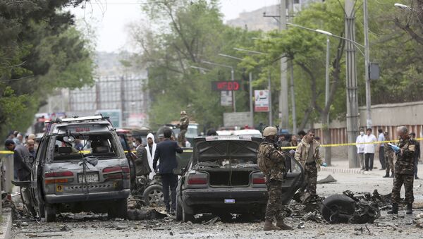 Security forces inspect the site of a suicide attack in Kabul, Afghanistan, Wednesday, May 3 , 2017 - Sputnik International