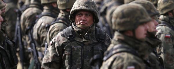 Polish soldiers attend welcoming ceremony for U.S.-led NATO troops at polygon near Orzysz, Poland, April 13, 2017 Polish soldiers attend welcoming ceremony for U.S.-led NATO troops at polygon near Orzysz, Poland, April 13, 2017 - Sputnik International