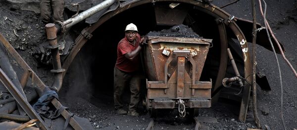 (File) In this Monday, Aug. 18, 2014 photo, an Iranian coal miner pushes a metal cart loaded with coal at a mine near the city of Zirab 212 kilometers (132 miles) northeast of the capital Tehran, on a mountain in Mazandaran province, Iran (File) In this Monday, Aug. 18, 2014 photo, an Iranian coal miner pushes a metal cart loaded with coal at a mine near the city of Zirab 212 kilometers (132 miles) northeast of the capital Tehran, on a mountain in Mazandaran province, Iran - Sputnik International