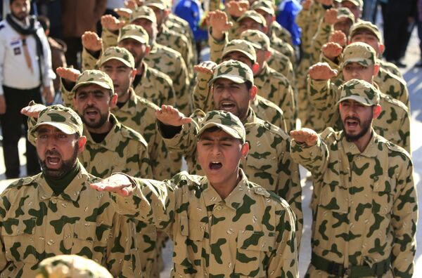 Hezbollah fighters parade during a ceremony to honor fallen comrades, in Tefahta village, south Lebanon, Saturday, Feb. 18, 2017 Hezbollah fighters parade during a ceremony to honor fallen comrades, in Tefahta village, south Lebanon, Saturday, Feb. 18, 2017 - Sputnik International
