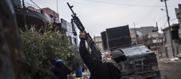 In this Sunday, Dec. 18, 2016 file photo, a member of the Iraqi Special Forces shoots his machine gun against an Islamic State militant drone n the al-Barid district in Mosul, Iraq In this Sunday, Dec. 18, 2016 file photo, a member of the Iraqi Special Forces shoots his machine gun against an Islamic State militant drone n the al-Barid district in Mosul, Iraq - Sputnik International