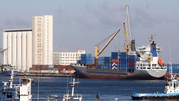 (File) A cargo ship docks at the port of the Libyan capital Tripoli on February 16, 2012 - Sputnik International