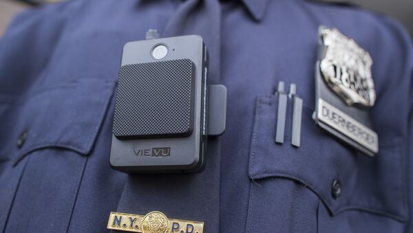 A police officer wears a newly issued body camera outside the 34th precinct, Thursday, April 27, 2017, in New York. - Sputnik International