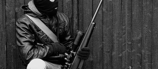 A man holding a rifle A man holding a rifle - Sputnik International