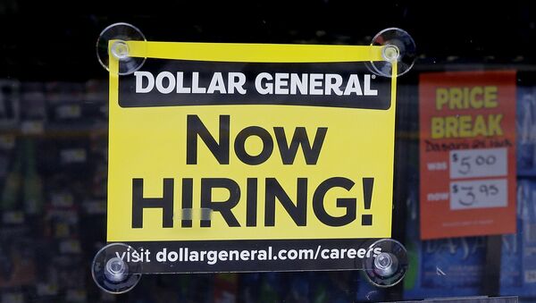 In this Wednesday, May 18, 2016, photo, a Now Hiring sign hangs in the window of a Dollar General store in Methuen, Mass. - Sputnik International