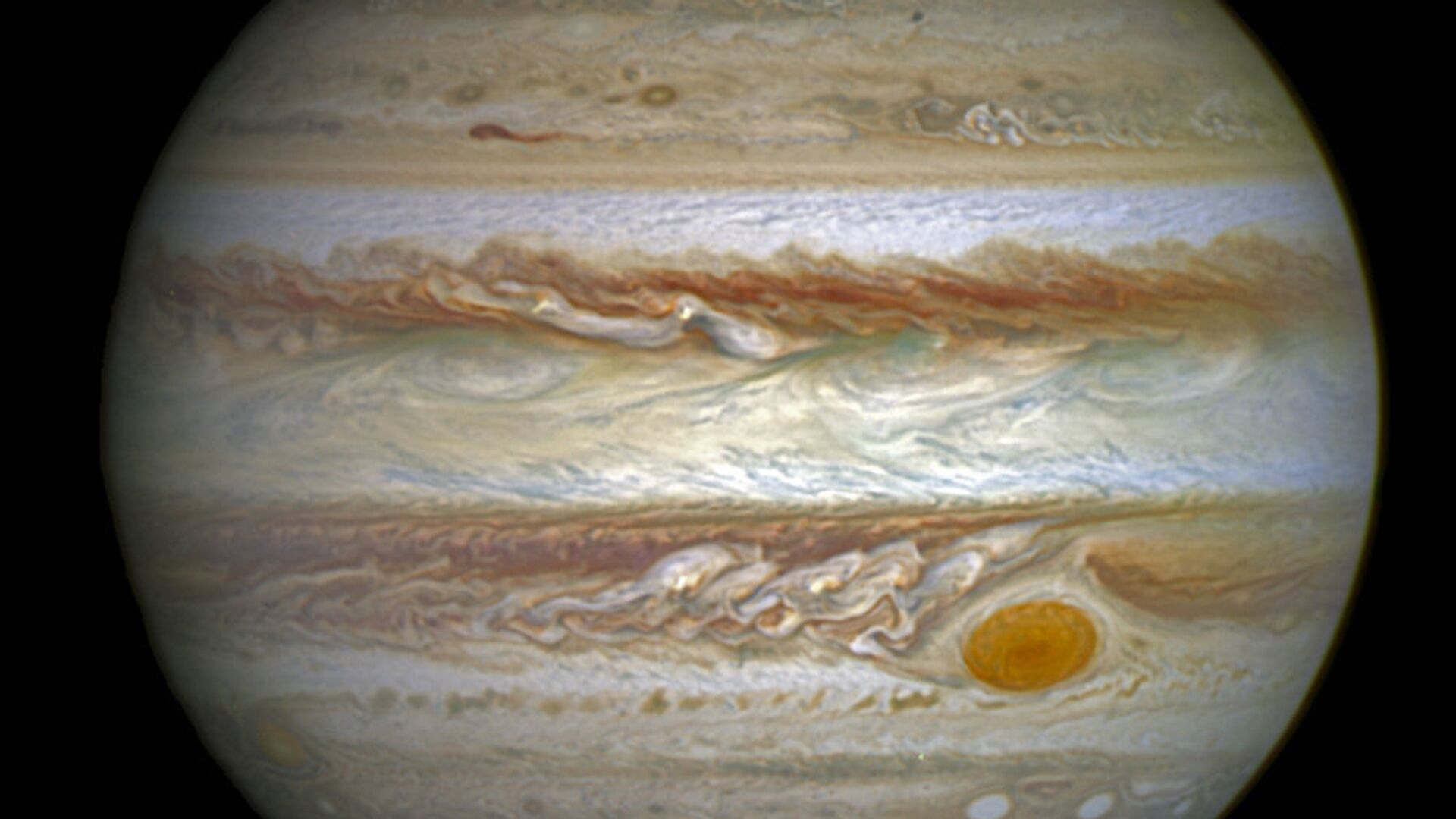 This composite image provided by NASA on Thursday, June 30, 2016 shows auroras on the planet Jupiter. This image produced by NASA using a photograph captured by the Hubble Space Telescope in spring 2014, and ultraviolet observations of the auroras in 2016.  - Sputnik International, 1920, 28.06.2021