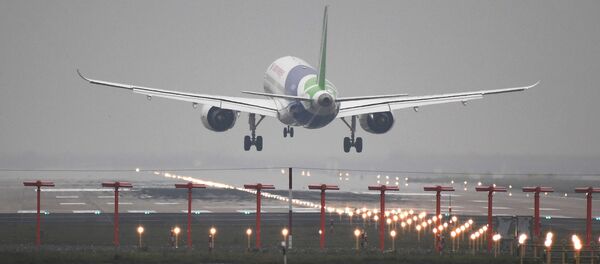 Chinese C919 passenger jet lands on its maiden flight at Pudong International Airport in Shanghai, China May 5, 2017 Chinese C919 passenger jet lands on its maiden flight at Pudong International Airport in Shanghai, China May 5, 2017 - Sputnik International