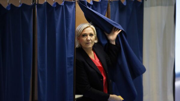 French far-right presidential candidate, Marine Le Pen exits a voting booth before casting her ballot in Henin Beaumont, France - Sputnik International
