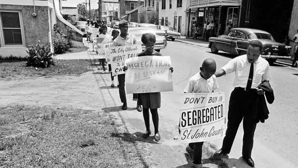 Dr. Martin Luther King, Jr. gives a young picket a pat on the back as a group of youngsters started to picket St. Augustine, Fla. - Sputnik International