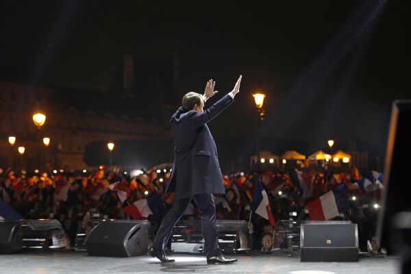 French president-elect Emmanuel Macron waves at supporters as he arrives on stage before delivering a speech in front of the Pyramid at the Louvre Museum in Paris on May 7, 2017, after the second round of the French presidential election. French president-elect Emmanuel Macron waves at supporters as he arrives on stage before delivering a speech in front of the Pyramid at the Louvre Museum in Paris on May 7, 2017, after the second round of the French presidential election. - Sputnik International