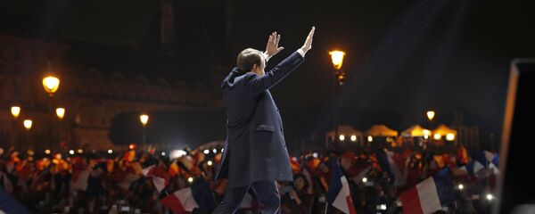 French president-elect Emmanuel Macron waves at supporters as he arrives on stage before delivering a speech in front of the Pyramid at the Louvre Museum in Paris on May 7, 2017, after the second round of the French presidential election. French president-elect Emmanuel Macron waves at supporters as he arrives on stage before delivering a speech in front of the Pyramid at the Louvre Museum in Paris on May 7, 2017, after the second round of the French presidential election. - Sputnik International
