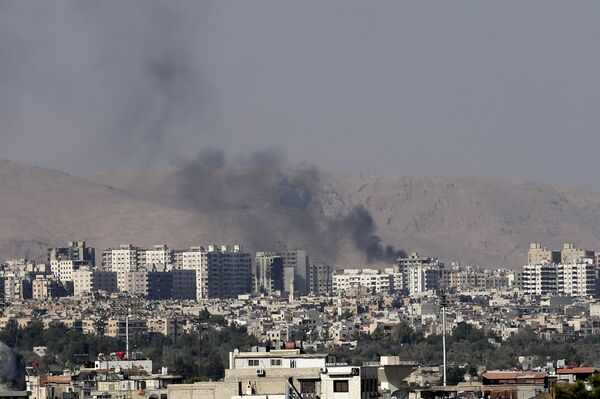 This Friday, August 23, 2013 file photo, black columns of smoke from heavy shelling in Barzeh, a suburb of Damascus, Syria. - Sputnik International
