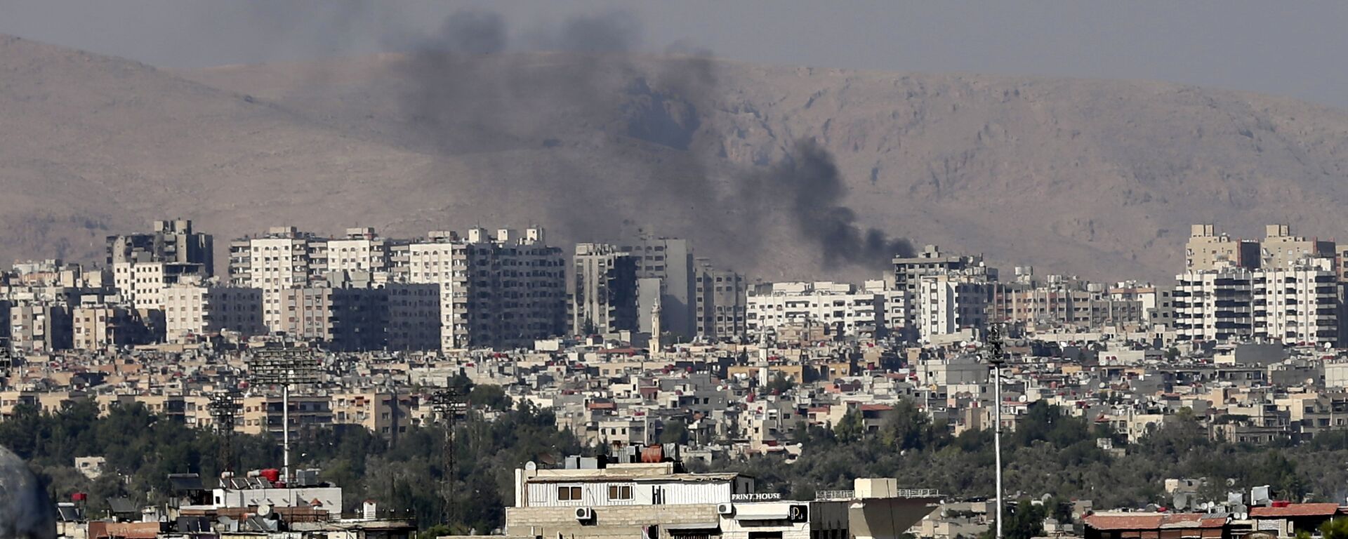 This Friday, August 23, 2013 file photo, black columns of smoke from heavy shelling in Barzeh, a suburb of Damascus, Syria. - Sputnik International, 1920, 16.12.2024