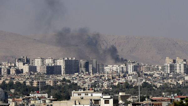 This Friday, August 23, 2013 file photo, black columns of smoke from heavy shelling in Barzeh, a suburb of Damascus, Syria. - Sputnik International