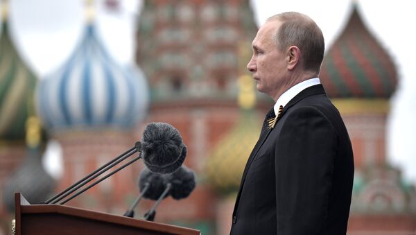 Russian President Vladimir Putin speaks during the Victory Day military parade marking the World War II anniversary at Red Square in Moscow. - Sputnik International