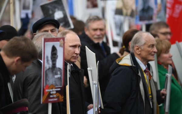 Russian President Vladimir Putin attends Immortal Regiment march during Victory Day celebrations, marking 72nd anniversary of victory over Nazi Germany in World War Two, at Red Square in central Moscow - Sputnik International
