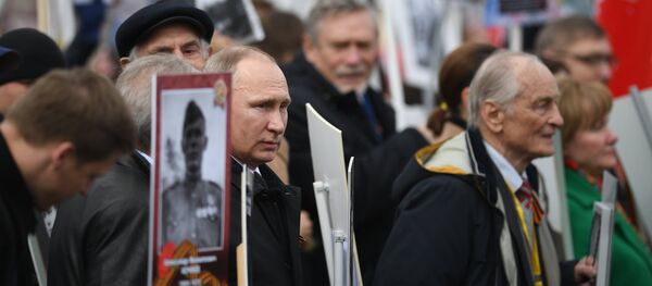 Russian President Vladimir Putin attends Immortal Regiment march during Victory Day celebrations, marking 72nd anniversary of victory over Nazi Germany in World War Two, at Red Square in central Moscow - Sputnik International