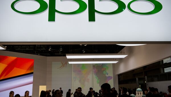 People visit the Oppo stand at the Mobile World Congress on the third day of the MWC in Barcelona - Sputnik International