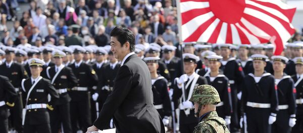 Japanese Prime Minister Shinzo Abe, center standing, reviews members of Japan Self-Defense Forces (SDF) during the Self-Defense Forces Day at Asaka Base, north of Tokyo, Sunday, Oct. 23, 2016. Japanese Prime Minister Shinzo Abe, center standing, reviews members of Japan Self-Defense Forces (SDF) during the Self-Defense Forces Day at Asaka Base, north of Tokyo, Sunday, Oct. 23, 2016. - Sputnik International