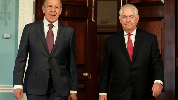 U.S. Secretary of State Rex Tillerson (R) walks with Russian Foreign Minister Sergey Lavrov before their meeting at the State Department in Washington, U.S - Sputnik International