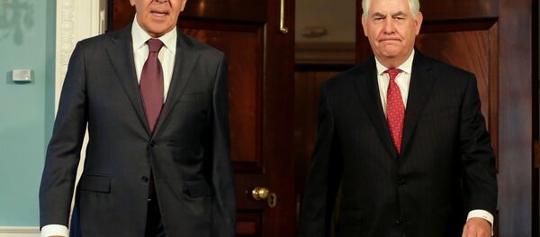 U.S. Secretary of State Rex Tillerson (R) walks with Russian Foreign Minister Sergey Lavrov before their meeting at the State Department in Washington, U.S - Sputnik International