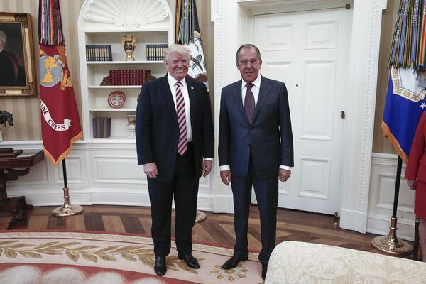 A handout photo made available by the Russian Foreign Ministry on May 10, 2017 shows US President Donald J. Trump (L) posing with Russian Foreign Minister Sergei Lavrov during a meeting at the White House in Washington, DC. A handout photo made available by the Russian Foreign Ministry on May 10, 2017 shows US President Donald J. Trump (L) posing with Russian Foreign Minister Sergei Lavrov during a meeting at the White House in Washington, DC. - Sputnik International