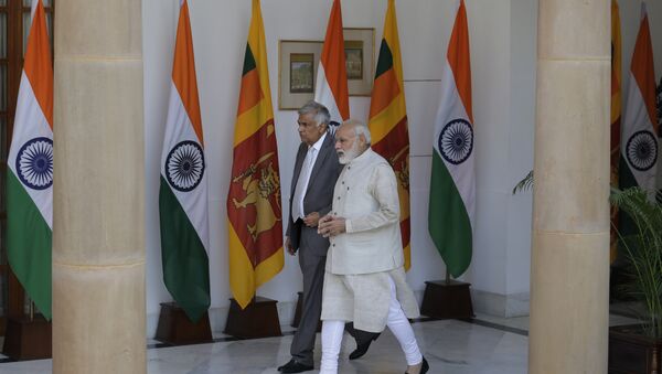Indian Prime Minister Narendra Modi, right, talks with his Sri Lankan counterpart Ranil Wickremesinghe as they walk for their meeting in New Delhi, India, Wednesday, April 26, 2017 - Sputnik International