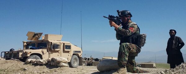 A member of Afghanistan special forces point his gun as he observes the enemy lines in Achin district of Nangarhar province, in eastern Afghanistan April 14, 2017 A member of Afghanistan special forces point his gun as he observes the enemy lines in Achin district of Nangarhar province, in eastern Afghanistan April 14, 2017 - Sputnik International