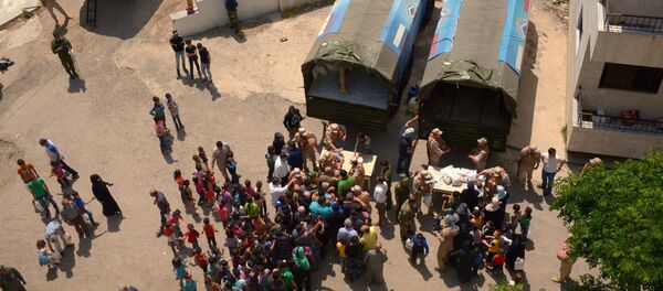 Russian humanitarian aid is distributed at Ras al-Bassit refugee camp - Sputnik International