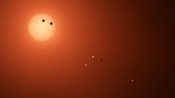 Artist's rendering of seven Earth-sized planets orbiting TRAPPIST-1 - Sputnik International