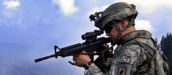 1st Lt. Chris Richelderfer, Executive Officer of Headquarters and Headquarters Troop, 1st Squadron, 91st Cavalry Regiment (Airborne), looks at possible enemy positions during Operation Saray Has July 19 near Forward Operating Base Naray, Afghanistan. - Sputnik International