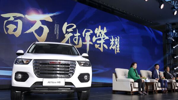 In this Sunday, Feb. 19, 2017 photo, Wei Jianjun, chairman of Great Wall Motors Ltd., second from right, speaks as a newly unveiled Haval SUV H6 model is displayed during a reception celebrating it sales passing the one million mark, at Great Wall headquarters in Baoding in north China's Hebei province. - Sputnik International
