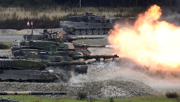 Tanks of several nations shoot at the same time during the friendship shooting of the exercise 'Strong Europe Tank Challenge 2017' at the exercise area in Grafenwoehr, near Eschenbach, southern Germany, on May 12, 2017 - Sputnik International