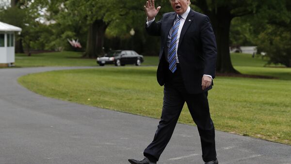 Trump waves as he walks into the White House in Washington - Sputnik International