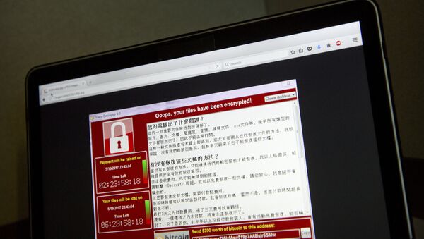 A screenshot of the warning screen from a purported ransomware attack, as captured by a computer user in Taiwan, is seen on laptop in Beijing, Saturday, May 13, 2017 - Sputnik International