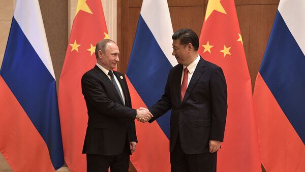 President Vladimir Putin and President of China Xi Jinping, right, during the Russia-China talks at the One Belt, One Road international forum - Sputnik International