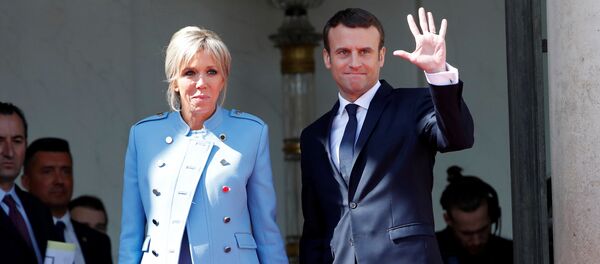 French President Emmanuel Macron and his wife Brigitte Trogneux wave to French President Francois Hollande (not pictured) as he leaves after the handover ceremony at the Elysee Palace in Paris, France, May 14, 2017 French President Emmanuel Macron and his wife Brigitte Trogneux wave to French President Francois Hollande (not pictured) as he leaves after the handover ceremony at the Elysee Palace in Paris, France, May 14, 2017 - Sputnik International