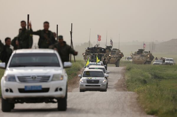Kurdish fighters from the People's Protection Units (YPG) head a convoy of U.S military vehicles in the town of Darbasiya next to the Turkish border, Syria April 28, 2017 Kurdish fighters from the People's Protection Units (YPG) head a convoy of U.S military vehicles in the town of Darbasiya next to the Turkish border, Syria April 28, 2017 - Sputnik International