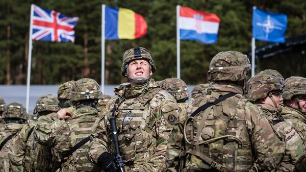 US soldiers are pictured prior the beginning of the official welcoming ceremony of NATO troops in Orzysz, Poland, on April 13, 2017. - Sputnik International