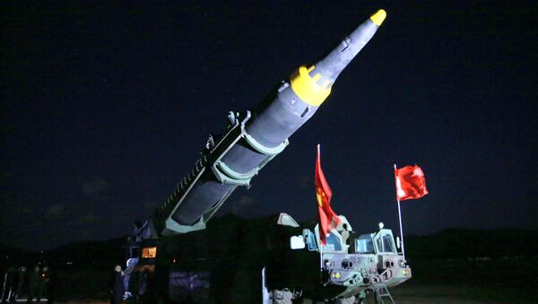 North Korean leader Kim Jong Un inspects the long-range strategic ballistic rocket Hwasong-12 (Mars-12) in this undated photo released by North Korea's Korean Central News Agency (KCNA) on May 15, 2017. - Sputnik International