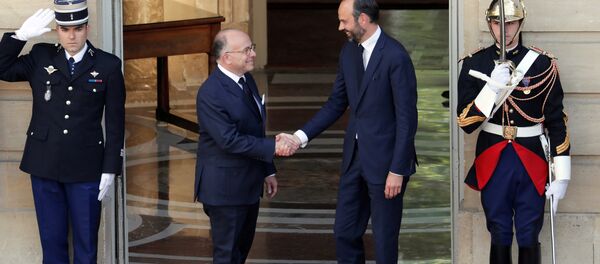 Newly-appointed French Prime Minister Edouard Philippe (R) is greeted by his predecessor Bernard Cazeneuve (L) during a handover ceremony at the Hotel Matignon, in Paris, France, May 15, 2017. Newly-appointed French Prime Minister Edouard Philippe (R) is greeted by his predecessor Bernard Cazeneuve (L) during a handover ceremony at the Hotel Matignon, in Paris, France, May 15, 2017. - Sputnik International